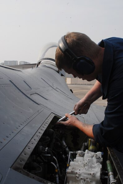 Staff Sgt. John Newhouse, 51st Aircraft Maintenance Squadron, performs flight control maintenance on an Osan F-16 Fighting Falcon Oct. 20 during exercise Max Thunder 10-2 at Kwangju Air Base, Republic of Korea. (U.S. Air Force photo/Staff Sgt. Eric Burks)