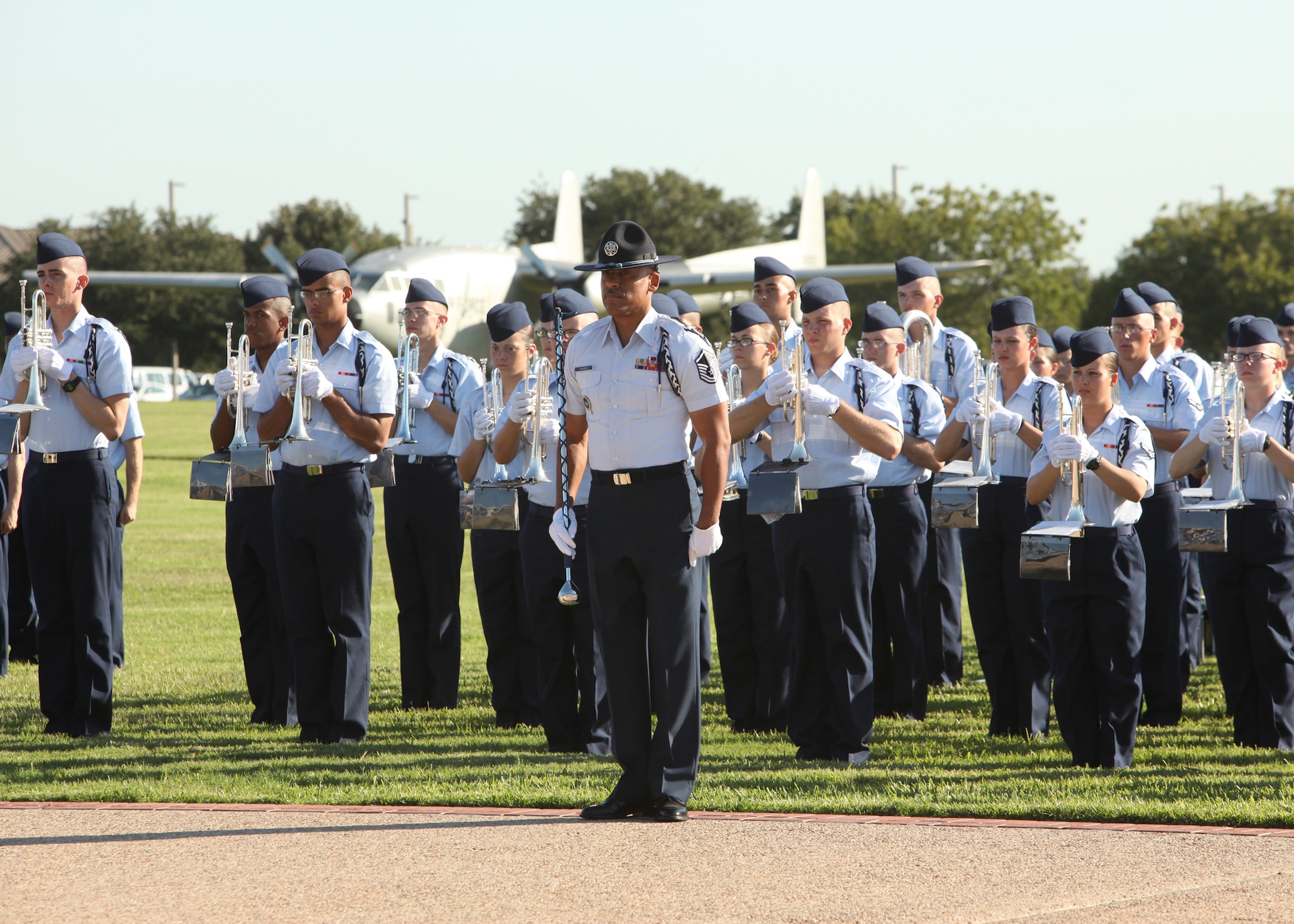 Retired Master Sgt. Samuel Johnson directs the 737th Training Group Drum & Bugle Corps during an Air Force Basic Military Training graduation parade Oct. 1. (U.S. Air Force photo/Robbin Cresswell)