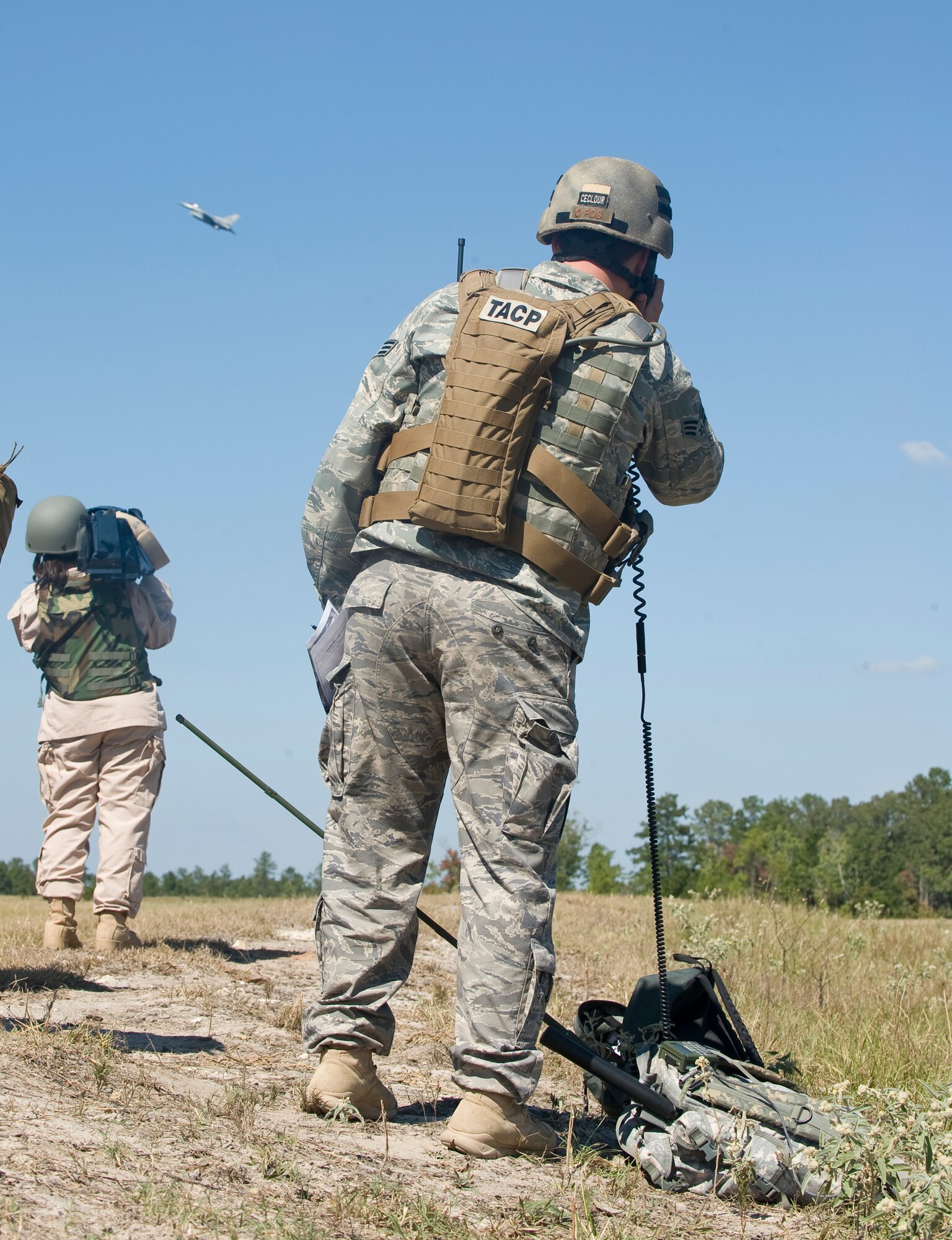 WARRIOR MILITARY OPERATIONS AREA, La. ? A Joint Terminal Attack Controller directs an F-16 Fighting Falcon to a target during a training scenario near Fort Polk, La., as part of Exercise Green Flag East 11-01 Oct. 13. GFE 11-01 is a global response exercise involving Air Force and Army personnel from various bases around the country. (U.S. Air Force photo by Senior Airman Chad Warren)(RELEASED)