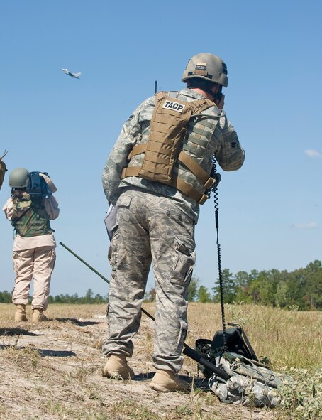 WARRIOR MILITARY OPERATIONS AREA, La. -- A Joint Terminal Attack Controller directs an F-16 Fighting Falcon to a target during a training scenario near Fort Polk, La., as part of Exercise Green Flag East 11-01 Oct. 13. GFE 11-01 is a global response exercise involving Air Force and Army personnel from various bases around the country. (U.S. Air Force photo by Senior Airman Chad Warren)(RELEASED)