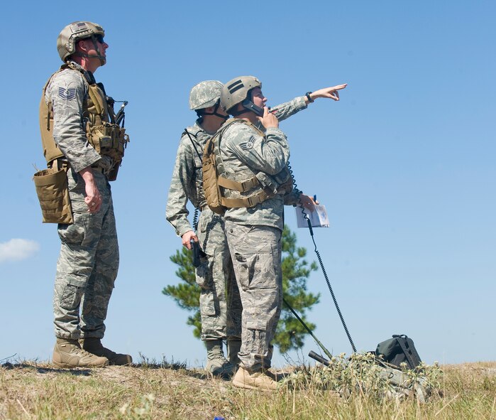 WARRIOR MILITARY OPERATIONS AREA, La. -- Joint Terminal Attack Controllers call in air support during a training scenario near Fort Polk, La., as part of Exercise Green Flag East 11-01 Oct. 13. GFE 11-01 is a global response exercise involving Air Force and Army personnel from various bases around the country. (U.S. Air Force photo by Senior Airman Chad Warren)(RELEASED)