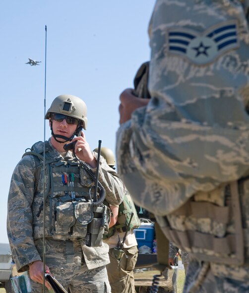 WARRIOR MILITARY OPERATIONS AREA, La. -- A Joint Terminal Attack Controller calls in air support during a training scenario near Fort Polk, La., as part of Exercise Green Flag East 11-01 Oct. 13. GFE 11-01 is a global response exercise involving Air Force and Army personnel from various bases around the country. (U.S. Air Force photo by Senior Airman Chad Warren)(RELEASED