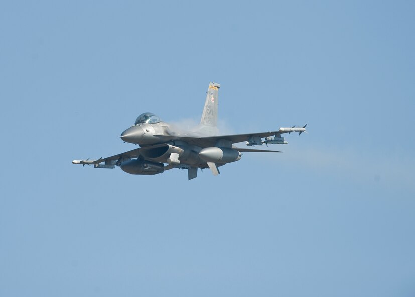 WARRIOR MILITARY OPERATIONS AREA, La. -- An F-16 Fighting Falcon from the 79th Fighter Squadron, Shaw Air Force Base, S.C., fires its 20mm M61 Vulcan six-barreled Gatling-style cannon during a training scenario near Fort Polk, La., as part of Exercise Green Flag East 11-01 Oct. 13. GFE 11-01 is a global response exercise involving Air Force and Army personnel from various bases around the country. (U.S. Air Force photo by Senior Airman Chad Warren)(RELEASED)