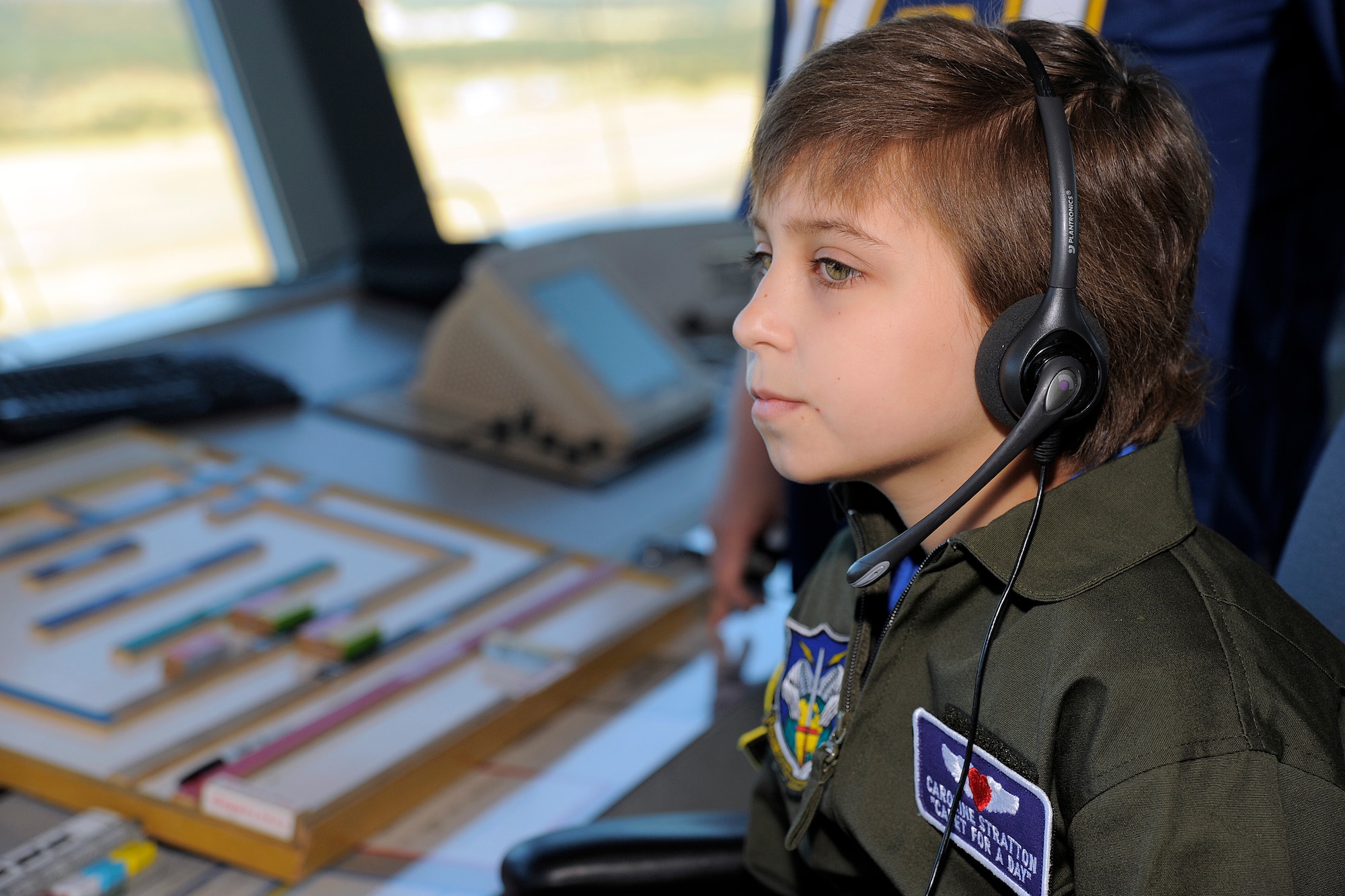 Caroline Stratton, 11, visits the air traffic control tower at the Air Force Academy Oct. 15, 2010. Caroline became a cadet for a day through the Make-a-Wish Program. Her father, Lt. Col. Chris Stratton, is assigned to the Space Innovation and Development Center at Schriever Air Force Base. (U.S. Air Force photo/J. Rachel Spencer)