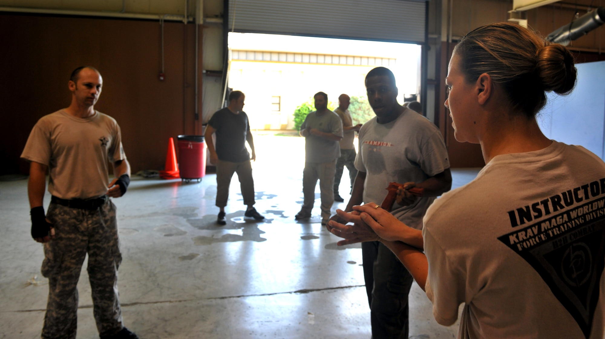 MOODY AIR FORCE BASE, Ga. -- Senior Airman Tanya Hermanowski, 820th Combat Operations Squadron tactical training and Krav Maga instructor, demonstrates the proper technique for a disarming scenario here Oct.  14. The objective of each KM training class is to teach members techniques to defend themselves against armed enemies in different scenarios. (U.S. Air Force photo/Airman 1st Class Joshua Green)
