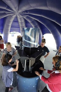 Randolph AFB, TX, 21 Oct 2010:  Spouses attending the AETC Commanders and Command Chiefs conference interact with kiosks designed to quiz participants on Air Force trivia and allow local recruiters to contact possible recruits even if they have gone to a race across the country.
 (U.S. Air Force photo/Steve Thurow)