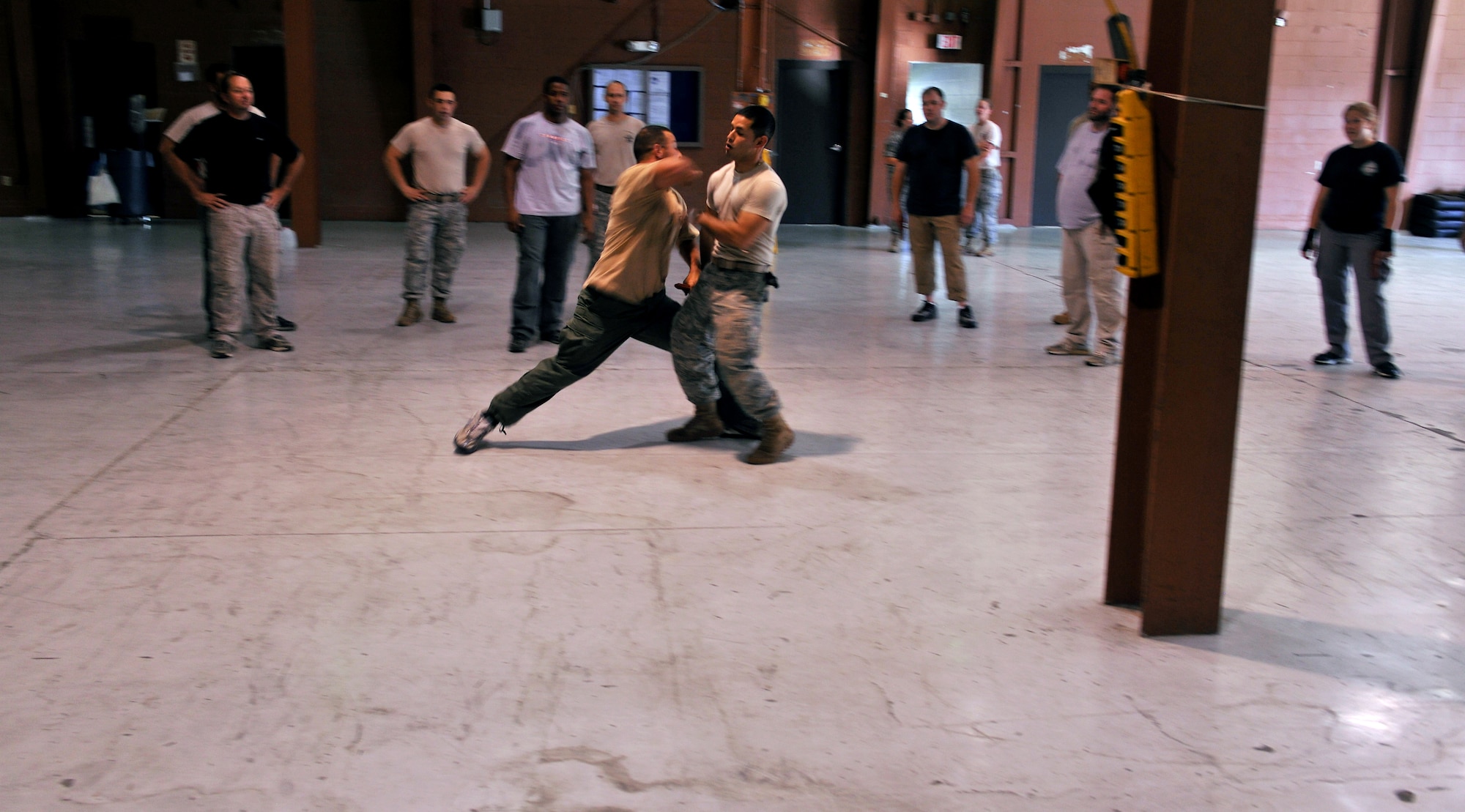 MOODY AIR FORCE BASE, Ga. -- During Krav Maga training, Steve Jaramillo, Lowndes County Sheriff’s Department reserve deputy, and Senior Airman Gabriel Rosario, 822nd Base Defense Squadron fire team leader, demonstrate a specific defense technique here Oct. 14. Krav Maga is the official self-defense system of the Israeli Defense Forces. The 822nd BDS has applied the techniques to better prepare Airmen for combat defense. (U.S. Air Force photo/Airman 1st Class Joshua Green)
