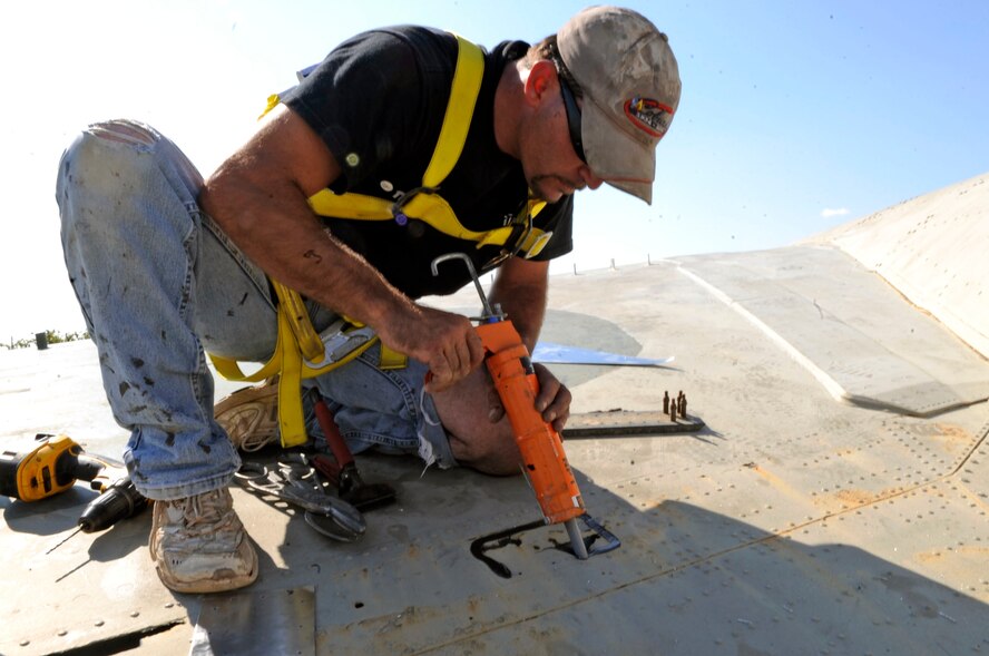 BARKSDALE AIR FORCE BASE, La. -- Contractor Greg George performs sheet-metal replacement on the Eighth Air Force Museum's B-52D bomber Oct. 20. The B-52D is going through restoration including sheet-metal replacement, cleaning and painting. This B-52D bomber has flown more than 400 missions during the Vietnam War and was used during Operation Linebacker II. (U.S. Air Force photo/Staff Sgt. John Gordinier)