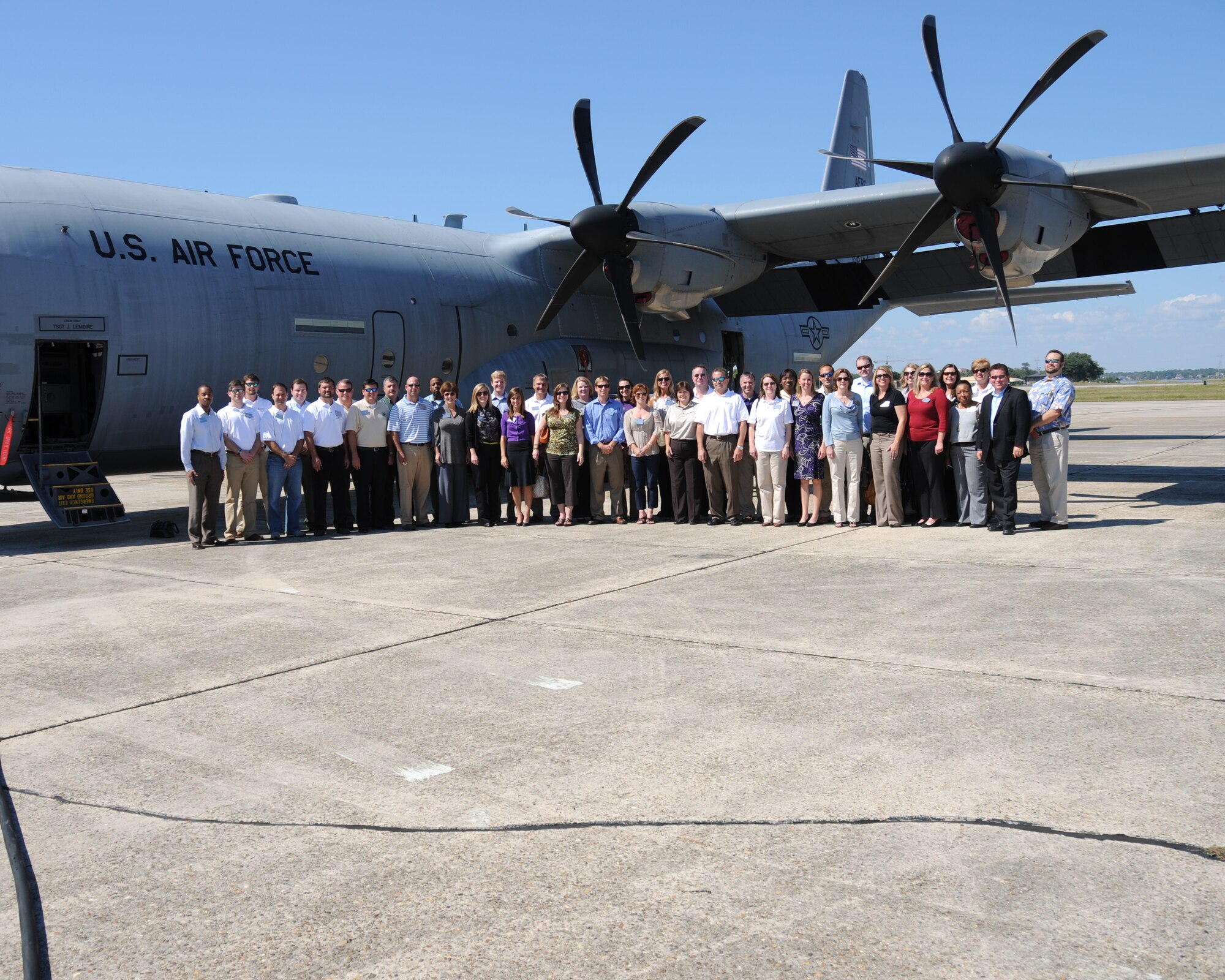 Leadership Gulf Coast members pose for a group photo in front of a C-130J aircraft before touring the aicraft Oct. 13.  Leadership Gulf Coast is a program sponsored by the Mississippi Gulf Coast Chamber of Commerce to prepare the area’s current and potential leaders for the future, to understand real problems and opportunities in our community, and to create a communication network between present and emerging leaders dedicated to the improvement of the Mississippi Gulf Coast. (U.S. Air Force photo by Kemberly Groue)