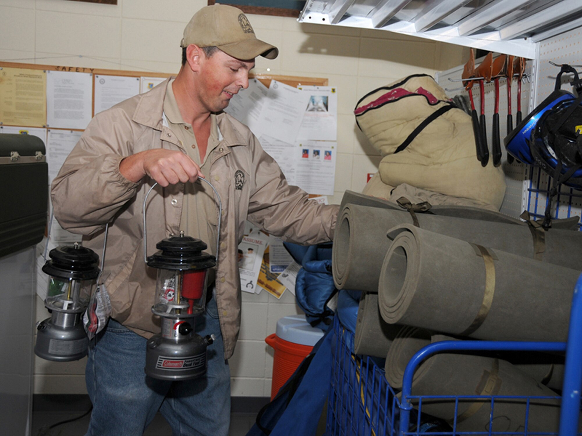 Outdoor recreation employee Sean Hoda arranges camping equipment available for rent.  (U.S. Air Force photo by Kemberly Groue)