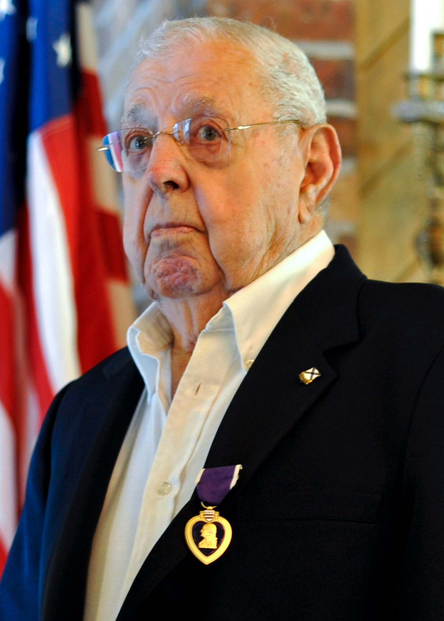 Charles “Buster” Donnell was presented the Purple Heart among other medals during a ceremony at the Air Force Enlisted Village, Shalimar, Fla., Oct 20. The 89-year-old veteran served in the Army in World War II, but later joined the Air Force. He retired from active duty in 1962. (U.S. Air Force photo/Samuel King Jr.)