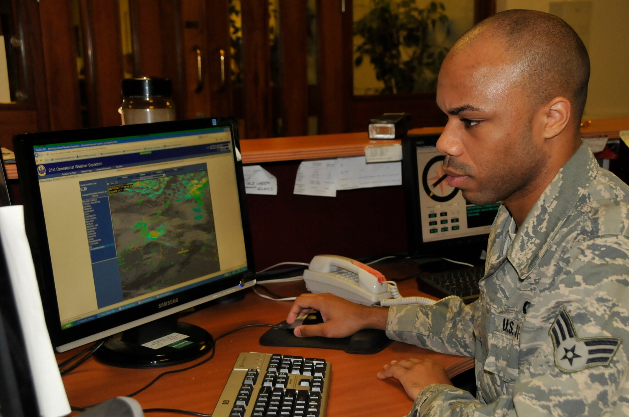 Senior Airman Regis Sullivan,48th Operation Support Squadron weather technician, checks out the current maps for the day in the local area at the wether center Oct 21. Airman Sullivan was nominated for a Liberty Spotlight because he displays the core value of "Excellence in All We Do". (U.S. Air Force photo/Airman 1st Class Eboni Knox)