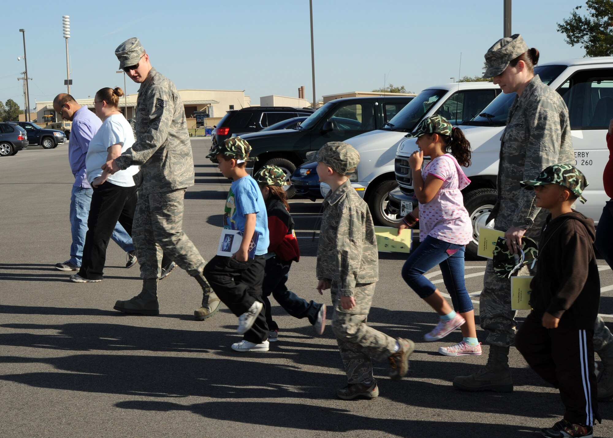 Staff Sgt. Jeremy Sifrit, 22nd Medical Support Squadron biomedical technician, teaches McConnell children how to march in formation during the Family Mobility Line, Oct. 16, 2010, McConnell Air Force Base, Kan.  The children marched to Building 1090 to “process” through a mock mobility line where they received individual mobility bags and briefings from McConnell’s intelligence, chaplain and medical Airmen.  (U.S. Air Force photo/Airman 1st Class Andrea Salazar)