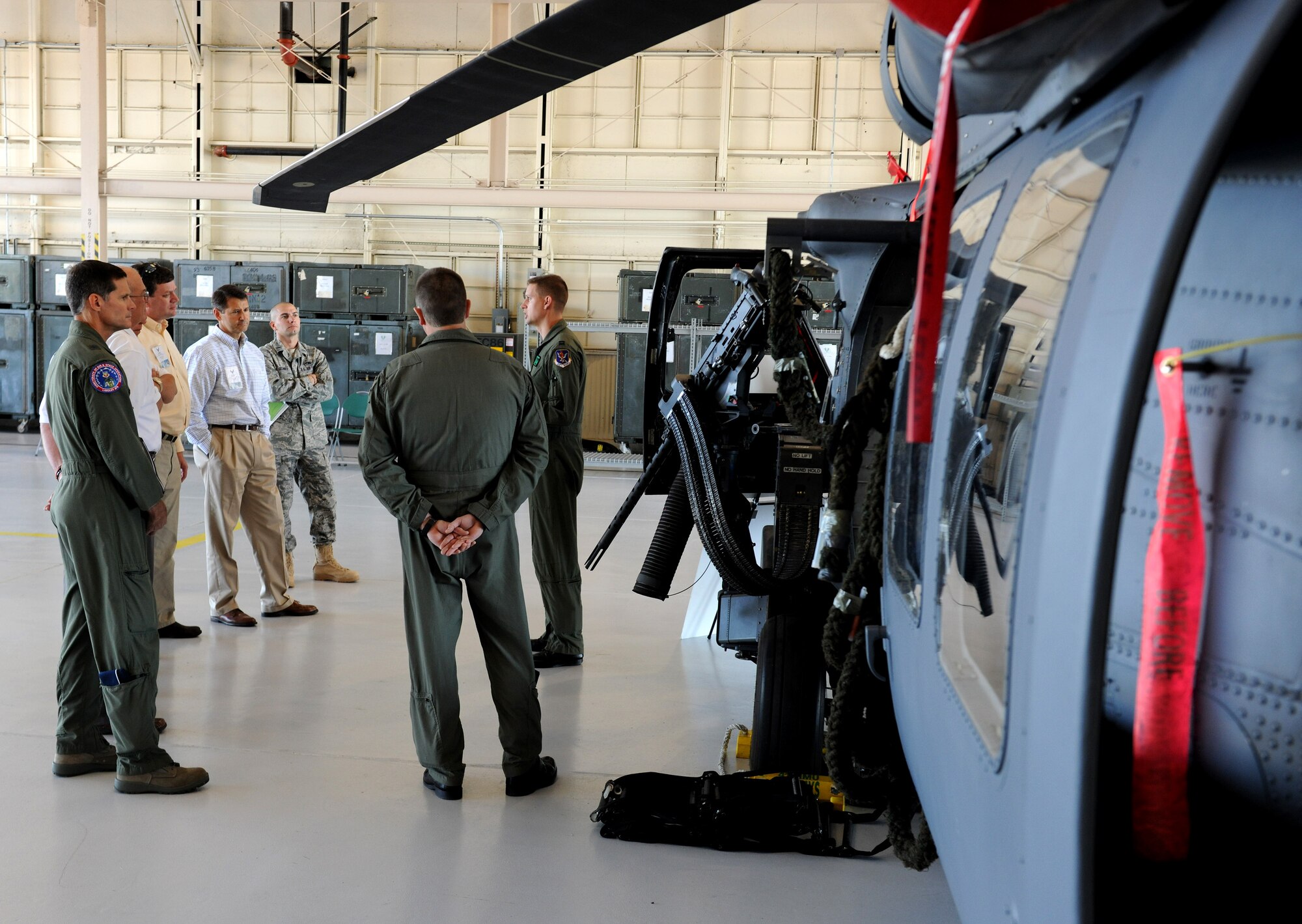 MOODY AIR FORCE BASE, Ga. -- Capt. Patrick Dugan, 41st Rescue Squadron HH-60G Pave Hawk pilot, discusses past missions flown by the 41st RQS during the Air Combat Command Commander’s Group visit here Oct. 18. Civic leaders were shown the mission capabilities of different squadrons stationed at Moody during their visit. (U.S. Air Force photo by Airman 1st Class Benjamin Wiseman)