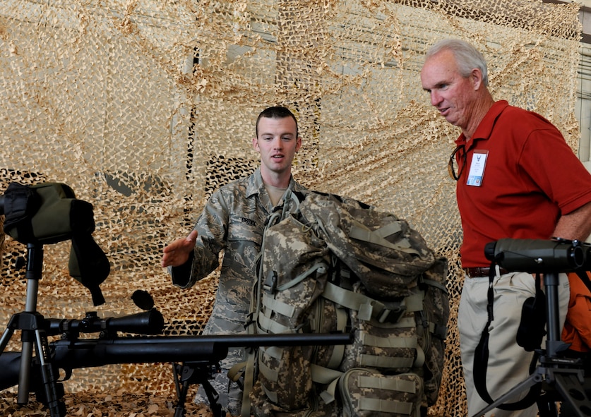 MOODY AIR FORCE BASE, Ga. -- Tech. Sgt. Garret Brown, 820th Combat Operations Squadron training NCO in-charge, explains the firing capabilities of an M-24 Sniper Weapon System rifle to Steven Rush, a civic leader from the 388th Fighter Wing from Hill AFB, Utah, during a base visit here Oct. 18. Several weapon systems used by the 820th Base Defense Group were put on display for members of the Air Combat Command Commander’s Group to interact with during their visit. (U.S. Air Force photo/Airman 1st Class Benjamin Wiseman)
