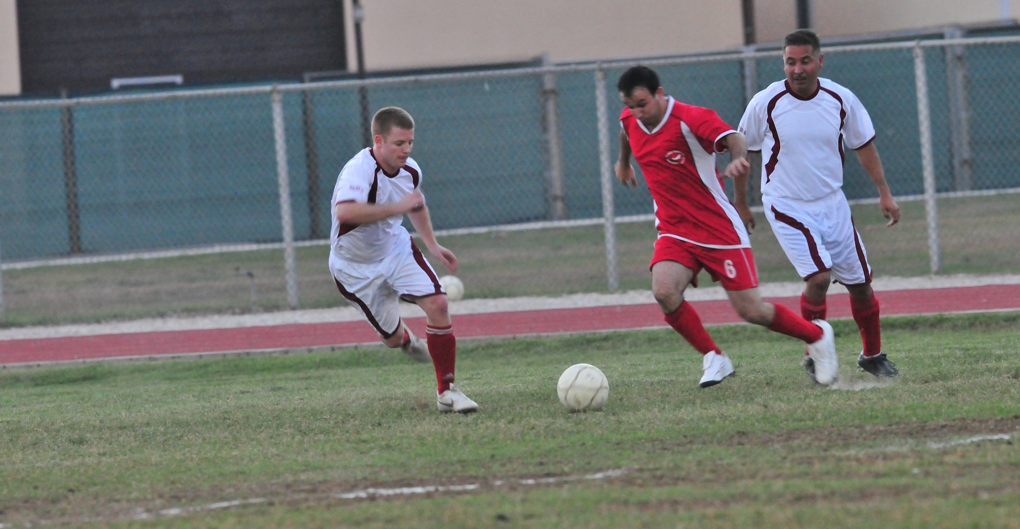 U.S., white jerseys, and Turkish Airmen at Incirlik Air Base, Turkey competed against each other during a semifinal soccer match Oct. 19, 2010. The game was part of an annual soccer tournament that included 11 Turkish teams and one U.S. team. The Turkish team won the game 5-4 and advanced to the finals scheduled for Oct. 22. (U.S. Air Force Photo/ Senior Airman Alexandre Montes/Released)