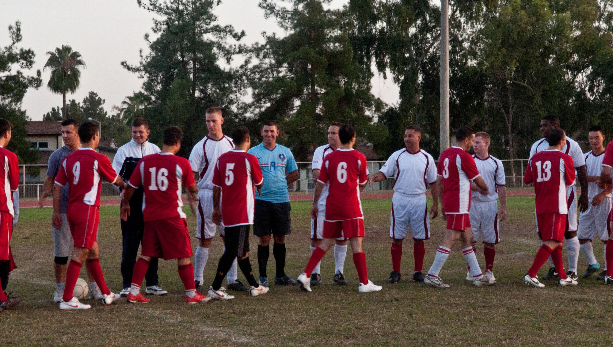 U.S. and Turkish Airmen at Incirlik Air Base, Turkey shake hands before a semifinal soccer match Oct. 19, 2010. The game was part of an annual soccer tournament that included 11 Turkish teams and one U.S. team. The Turkish team won the game 5-4 and advanced to the finals scheduled for Oct. 22. (U.S. Air Force Photo/ Senior Airman Alexandre Montes/Released)
