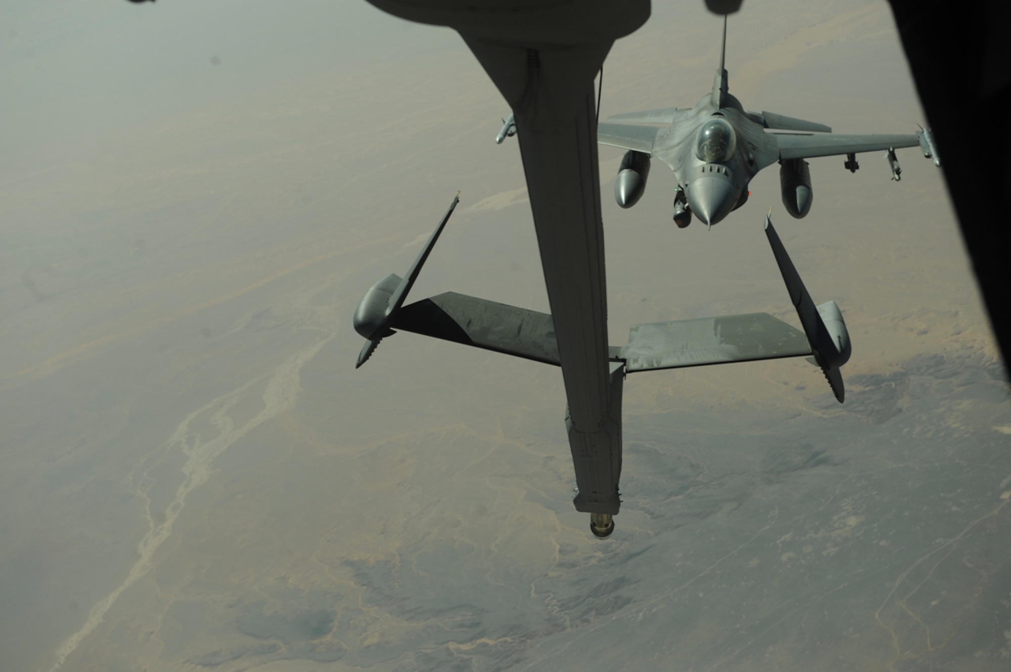 A U.S. Air Force KC-10 Extender from the 2nd Air Refueling Squadron at Joint Base McGuire, N.J. refuels U.S. Air Force and Royal Jordanian Air Force F-16 Fighting Falcons as part of The Falcon Air Meet 2010 near Azraq Air Base, Jordan, Oct. 20, 2010.  The purpose of The Falcon Air Meet is to improve international military relations and joint air operations.  (U.S. Air Force Photo/Staff Sgt. Eric Harris) 