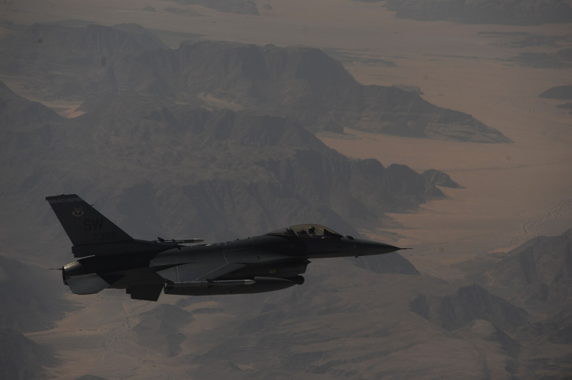 A U.S. Air Force F-16 Fighting Falcon from the 77th Fighter Squadron, Shaw Air Force Base, S.C., flies in formation with a U.S. Air Force KC-10 Extender from the 2nd Air Refueling Squadron at Joint Base McGuire, N.J. after receiving fuel as part of The Falcon Air Meet 2010 near Azraq Air Base, Jordan, Oct. 20, 2010.  The U.S., Jordan and Pakistan are participating in the The Falcon Air Meet to improve international military relations and joint air operations.  (U.S. Air Force Photo/Staff Sgt. Eric Harris) 