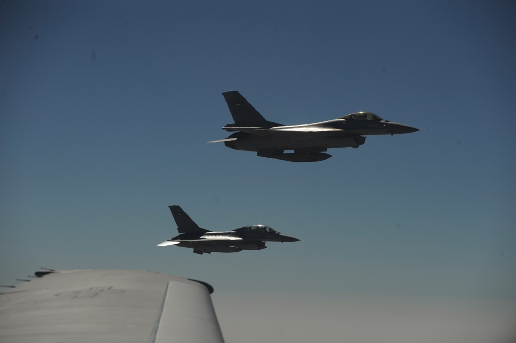 Royal Jordanian Air Force F-16 Fighting Falcons fly in formation with a U.S. Air Force KC-10 Extender from the 2nd Air Refueling Squadron at Joint Base McGuire, N.J. after receiving fuel as part of The Falcon Air Meet 2010 near Azraq Air Base, Jordan, Oct. 20, 2010.  The U.S., Jordan and Pakistan are participating in the The Falcon Air Meet to improve international military relations and joint air operations.  (U.S. Air Force Photo/Staff Sgt. Eric Harris)