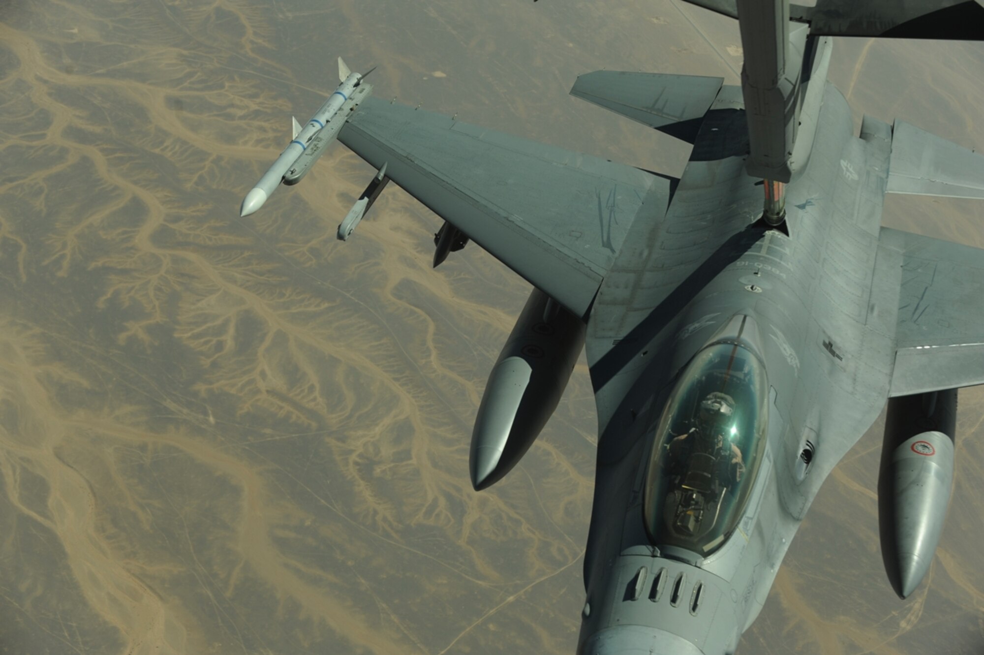 A U.S. Air Force F-16 Fighting Falcon from the 77th Fighter Squadron, Shaw Air Force Base, S.C., receives fuel from a KC-10 Extender from the 2nd Air Refueling Squadron, Joint Base McGuire, N.J., as part of The Falcon Air Meet 2010 near Azraq Air Base, Jordan, Oct. 20, 2010.  The purpose of The Falcon Air Meet is to improve international military relations and joint air operations.  (U.S. Air Force Photo/Staff Sgt. Eric Harris)