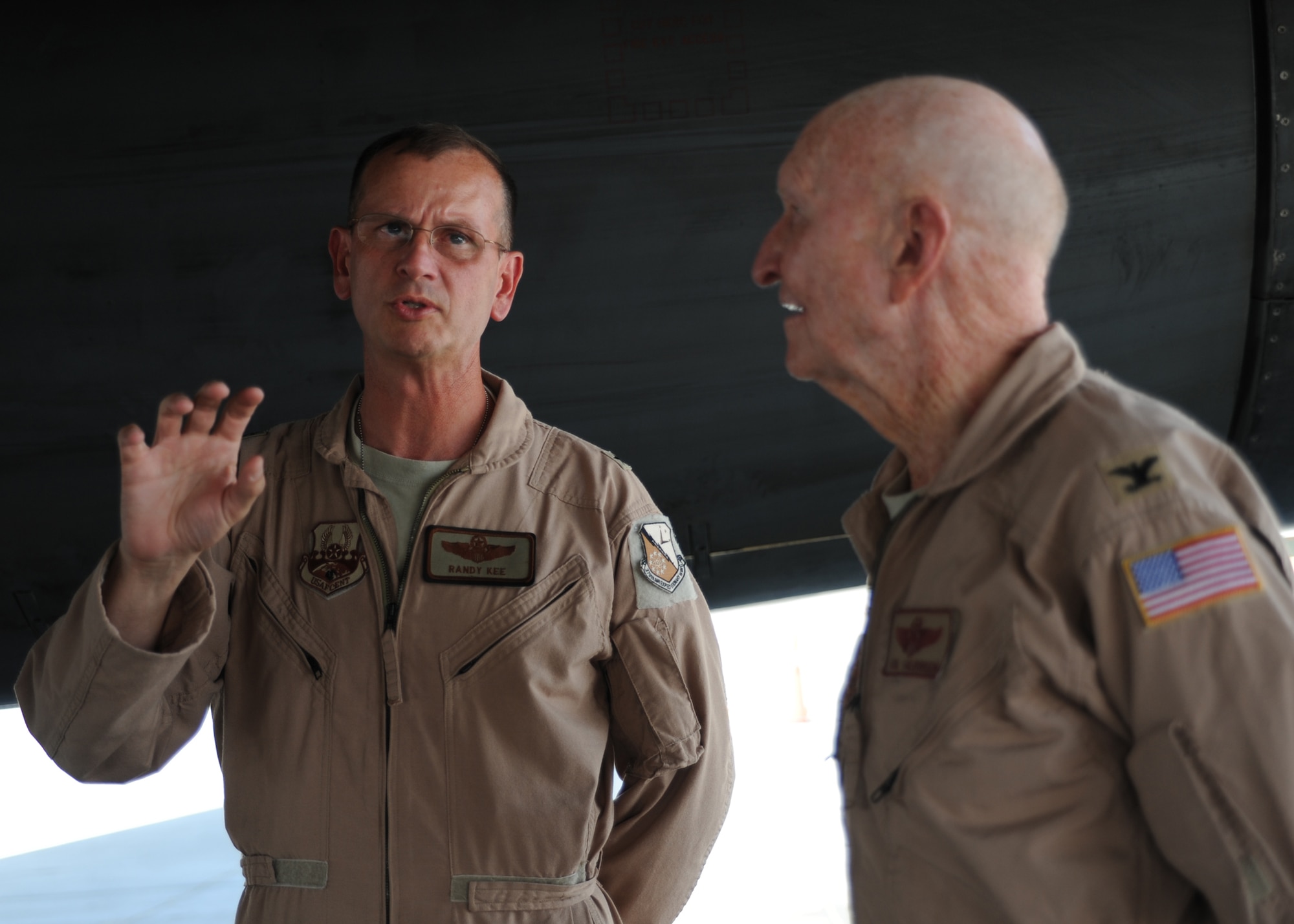 Brig. Gen. Randy Kee speaks to retired Col. Gail Halvorsen about the B-1B at an undisclosed location in Southwest Asia, Oct. 21. General Kee is the 379th Air Expeditionary Wing commander and Colonel Halvorsen is a retired pilot. (U.S. Air Force photo/Senior Airman Katie Gieratz)(RELEASED)