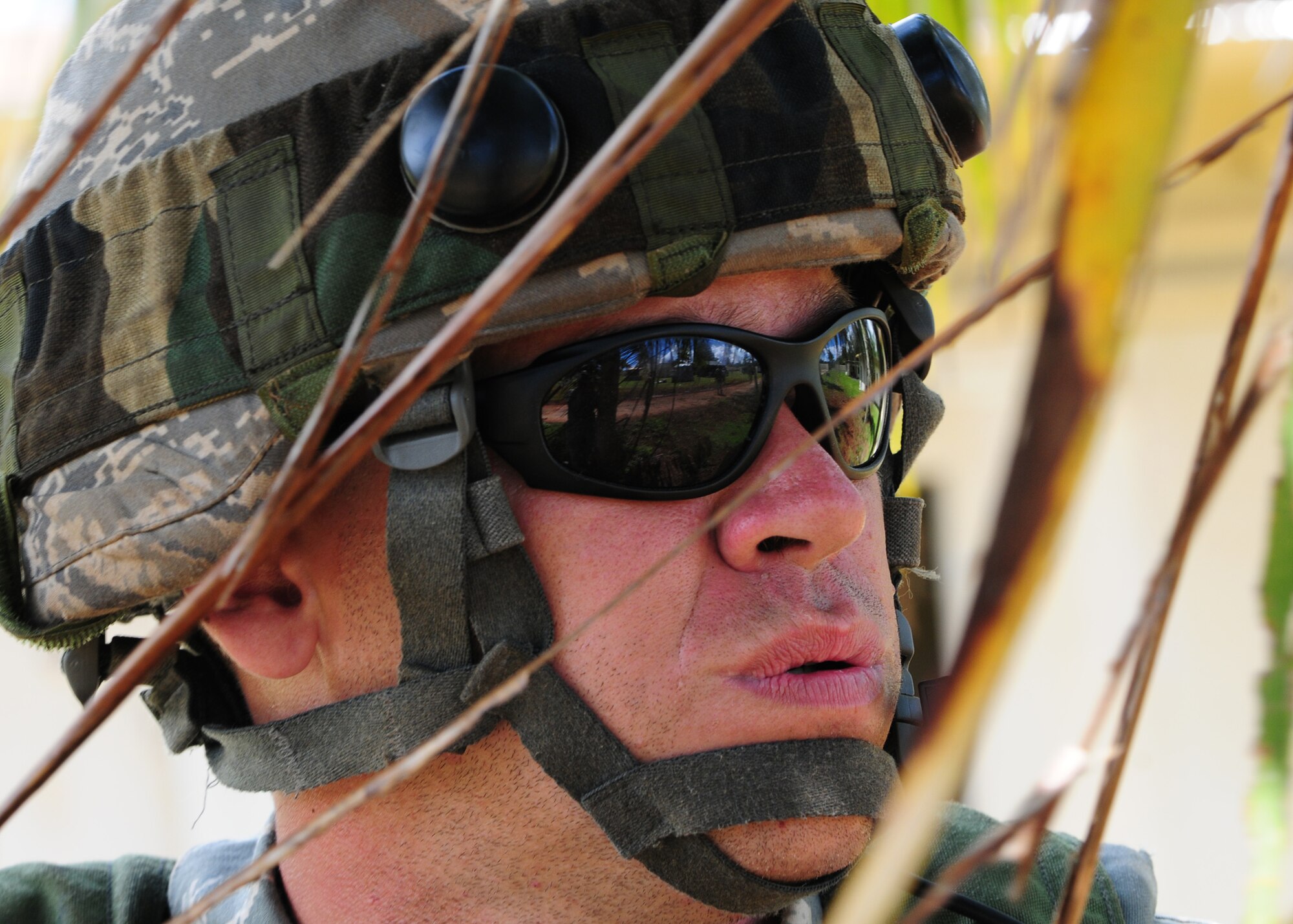 Master Sgt. Paul Schafroth, 644th Combat Communications Squadron Airman, scans the perimeter during Combat Readiness School?s field training exercise at Andersen Air Force Base, Guam, Oct. 19, 2010. Andersen Airmen teamed up with members of the RAAF for a 20-day Combat Readiness School at Andersen South training base to both teach the Airmen new tactics and act as a refresher course for those who were already familiar with the training. (U.S. Air Force photo/ Senior Airman Nichelle Anderson)