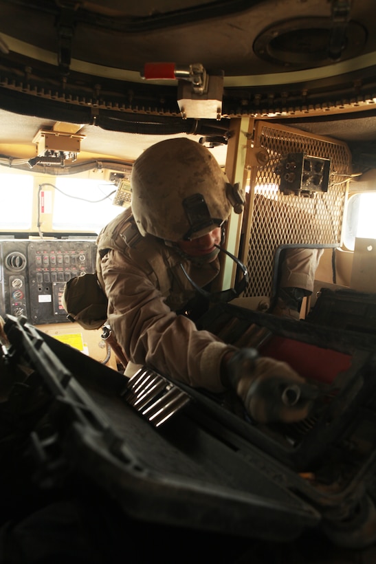 Sgt. Shane Hunter, a tactical vehicle mechanic with Marine Wing Support Squadron 373, quickly shuffles through his toolbox as he attempts a hasty repair on a dead-lined vehicle convoying from Camp Leatherneck to Forward Operating Base Dwyer.  Hunter was able to unlock the breaks of a Mine Resistant Ambush Protected vehicle and rig it for tow.  The convoy was on the move again with minimal down time.   By conducting convoy operations, MWSS-373 motor transport Marines provide logistical support for 3rd Marine Aircraft Wing (Forward) throughout Afghanistan.