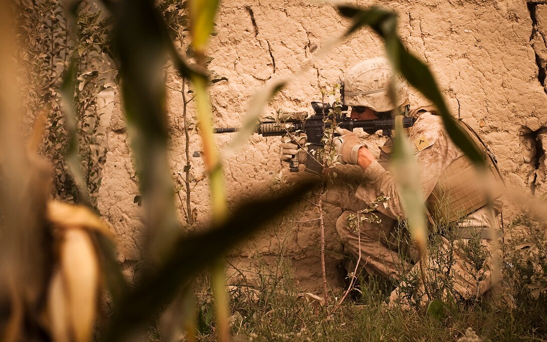 Pfc. Steven L. Blizzard, a driver with Jump Platoon, 3rd Battalion, 3rd Marine Regiment, provides security while escorting media through the Nawa Bazaar in Helmand province, Afghanistan, Oct. 22, 2010. Jump Platoon’s primary mission is to provide security for the battalion commander and transport him throughout 3/3’s battle space, but the platoon performs a variety of tasks from providing supplementary security and running vehicle checkpoints, to masonry and gardening. Blizzard is from Clare, Mich.