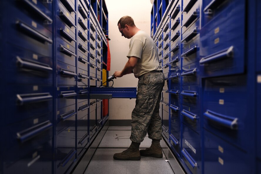 Staff Sgt. Robert Wilson, 735th Air Mobility Squadron consolidated tool kit technician, reaches for a tool at the joint consolidated tool kit at Joint Base Pearl Harbor-Hickam, Hawaii, on Oct. 22, 2010. The consolidated tool kit is a tool shop made up of 15th Aircraft Maintenance Squadron and 735th Air Mobility Squadron consolidated tool kit Airmen. (U.S. Air Force Photo/Senior Airman Gustavo Gonzalez) 