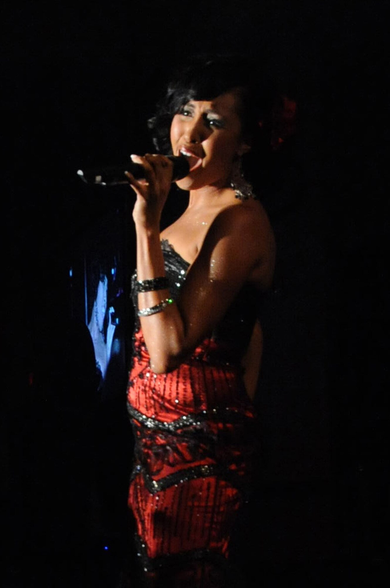 Staff Sgt. Aisha Smith, MacDill AFB, performed "God Bless the Child" at the Scott Club during the Air Mobility Command Icon on Thursday, Aug. 21, 2010. Sergeant Smith won first place with a grand prize of $1000.00. (Photo by Tech. Sgt. Michelle Larche)