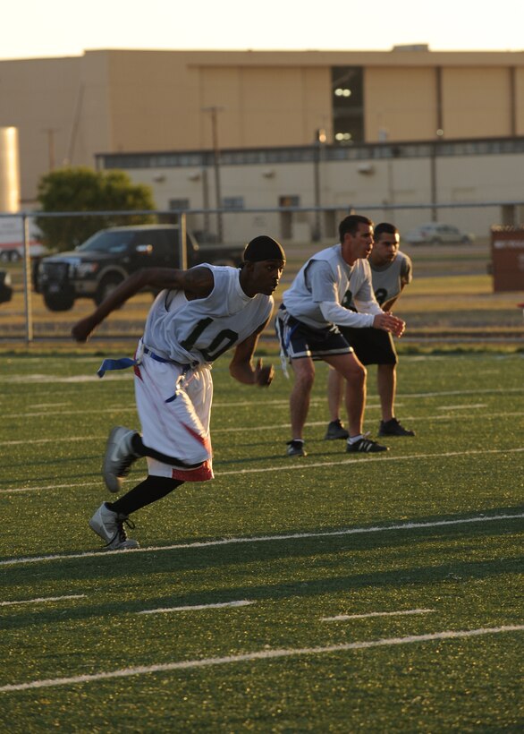 DYESS AIR FORCE BASE, Texas—Gregory Showell, 7th Bomb Wing receiver, runs to get open Oct. 18 during an intramural football game here. Participating in intramural sports helps bring Dyess Airmen together and boosts morale throughout the base. The football season started in late September and continues through December. Other intramural sports include: basketball, racquetball, soccer, volleyball, golf and softball. For more information about intramural sports, call the fitness center at (325) 696-4306. (U.S Air Force photo/ Airman 1st Class Shannon Hall)