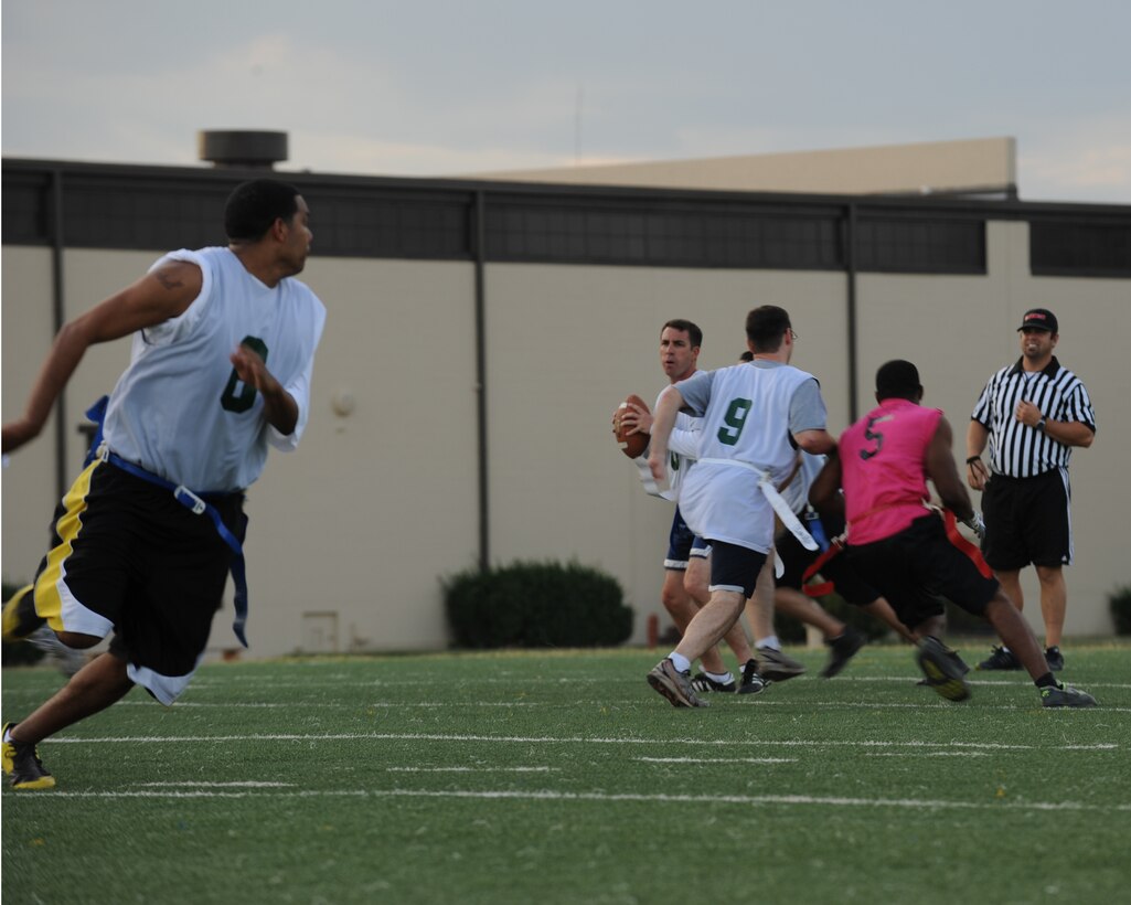 DYESS AIR FORCE BASE, Texas—Marc London, 7th Bomb Wing quarterback, looks to pass the football Oct. 18 during an intramural football game here. Participating in intramural sports helps bring Dyess Airmen together and boosts morale throughout the base. The football season started in late September and continues through December. Other intramural sports include: basketball, racquetball, soccer, volleyball, golf and softball. For more information about intramural sports, call the fitness center at (325) 696-4306. (U.S Air Force photo/ Airman 1st Class Shannon Hall)
