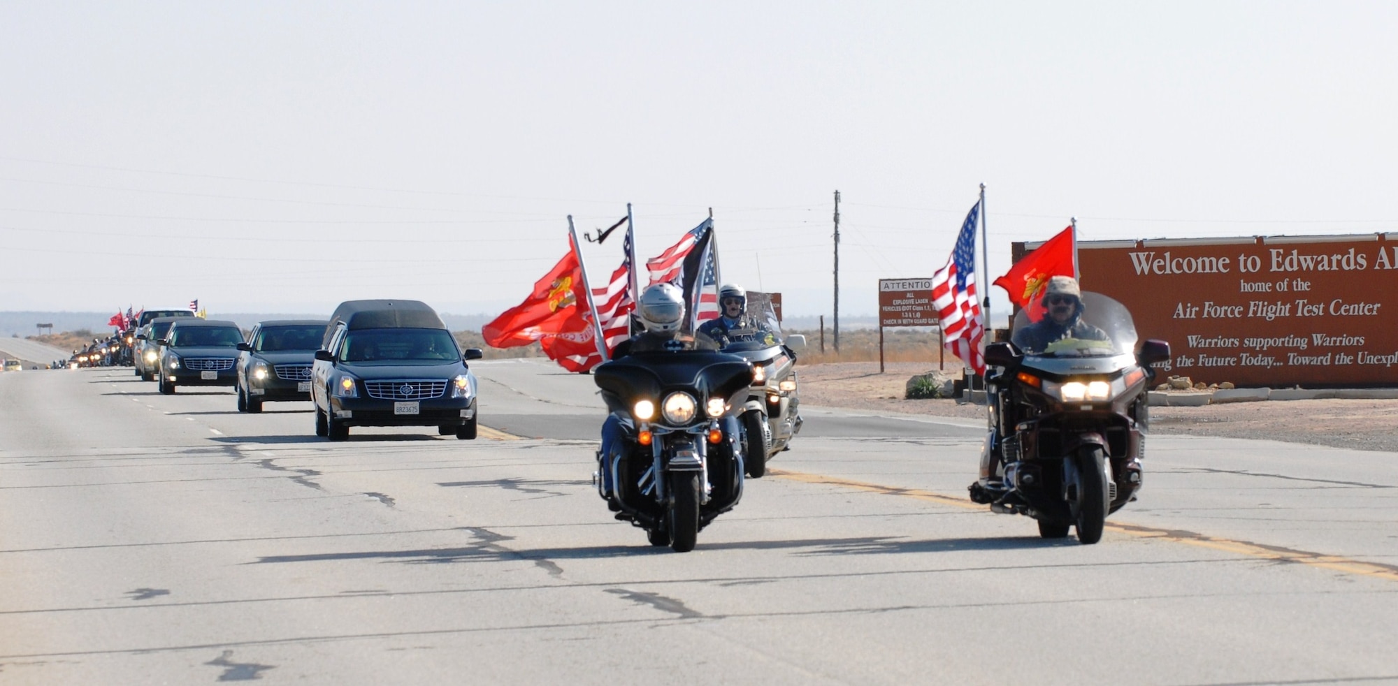 Lance Cpl. Joseph C. Lopez’s funeral procession leaves Edwards Air Force Base, Calif.  Corporal Lopez, 26, is from Rosamond, Calif., just outside Edwards AFB. He was killed in action during combat operations in Helmend province Afghanistan, Oct. 14.  He was assigned to the 3rd Battalion, 5th Marine Regiment, 1st Marine Division, I Marine Expeditionary Force, Camp Pendleton, Calif. He was transported to Lancaster, Calif., for final rites.  Governor Arnold Schwarzenegger issued the following statement regarding the death of Lance Corporal Lopez: “Maria and I were very saddened to learn of the death of Lance Corporal Joseph Lopez. He was an outstanding Marine and loyal patriot. We join all Californians in honoring his admirable service and the sacrifice he made to defend the freedoms we are fortunate to enjoy every day. May Joseph’s family and loved ones find comfort and peace in his memory.” (Air Force photo by Stephen K. Robinson)