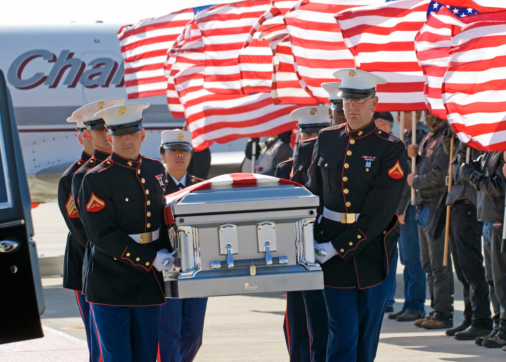 The remains of Lance Cpl. Joseph C. Lopez, U.S. Marine Corps, are carried by a Marine honor guard to an awaiting hearse after landing at Edwards Air Force Base, Calif, Oct. 22.  Lance Corporal Lopez, 26, is from Rosamond, Calif. He was killed in action during combat operations in Helmend province Afghanistan, Oct. 14.  He was assigned to the 3rd Battalion, 5th Marine Regiment, 1st Marine Division, I Marine Expeditionary Force, Camp Pendleton, Calif. He was transported to Lancaster, Calif., for final rites and under escort of his family, the U.S.M.C., and the patriot Guard Riders. (Air Force photo by Rob Densmore)
