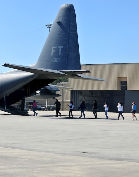 MOODY AIR FORCE BASE, Ga. – Spouses make their way toward the tail of an HC-130P Combat King during the 23rd Maintenance Group’s Spouse Orientation Day here Oct. 22. Spouses were given the opportunity to fly on military aircraft as a part of their orientation. (U.S. Air Force photo/Airman 1st Class Joshua Green)
