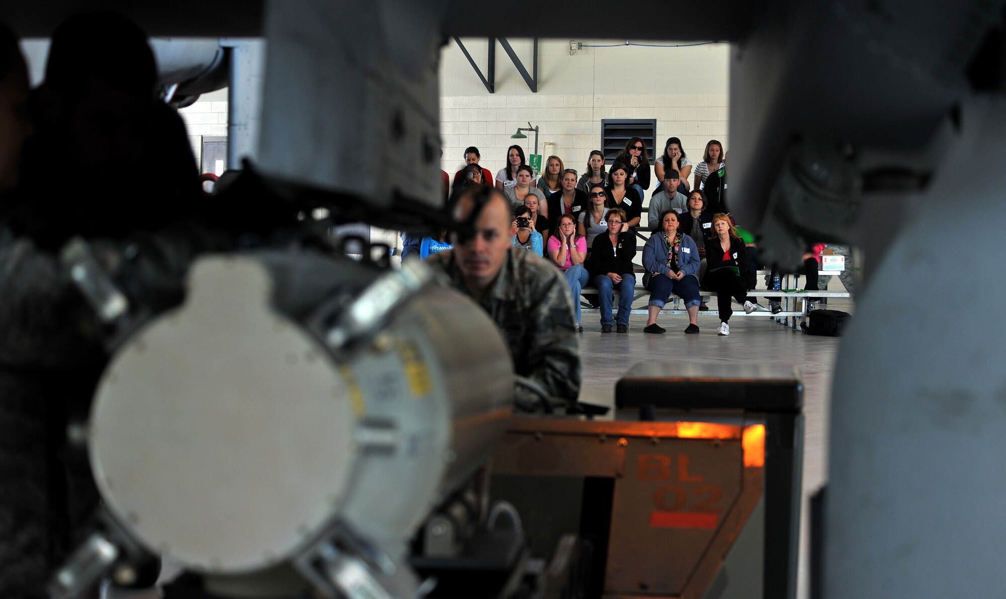 MOODY AIR FORCE BASE, Ga. -- Moody Spouses watch an A-10C Thunderbolt II during a weapons load demo during the 23rd Maintenance Group’s Spouse Orientation Day here Oct. 22. The day was put in place to give the spouses of Moody Airmen a chance to have an inside look of what their wives and husbands do on a daily basis. (U.S. Air Force photo/Airman 1st Class Joshua Green)

