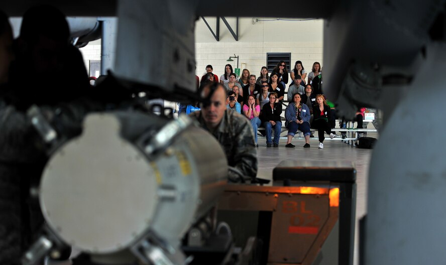 MOODY AIR FORCE BASE, Ga. -- Moody Spouses watch an A-10C Thunderbolt II during a weapons load demo during the 23rd Maintenance Group’s Spouse Orientation Day here Oct. 22. The day was put in place to give the spouses of Moody Airmen a chance to have an inside look of what their wives and husbands do on a daily basis. (U.S. Air Force photo/Airman 1st Class Joshua Green)
