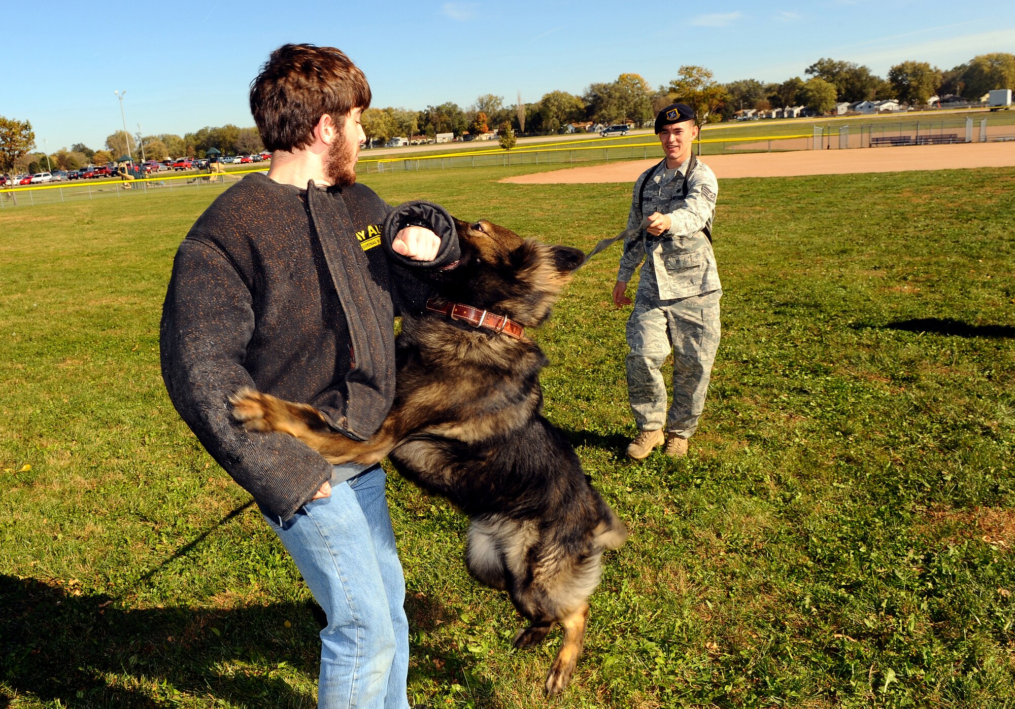 OFFUTT AIR FORCE BASE, Neb. - John Truemper, a Iowa Western student and new Air Force recruit, experiences the strength and determination of military working dog Tommy, a Belgian malinois while 55th Security Forces Squadron dog handler SSgt Joel Therrien monitors the demonstration at the youth baseball fields Oct. 20.  The demonstration was part of a base wide tour for high school and college students ready to enlist in the Air Force.
U.S. Air Force photo by Josh Plueger

