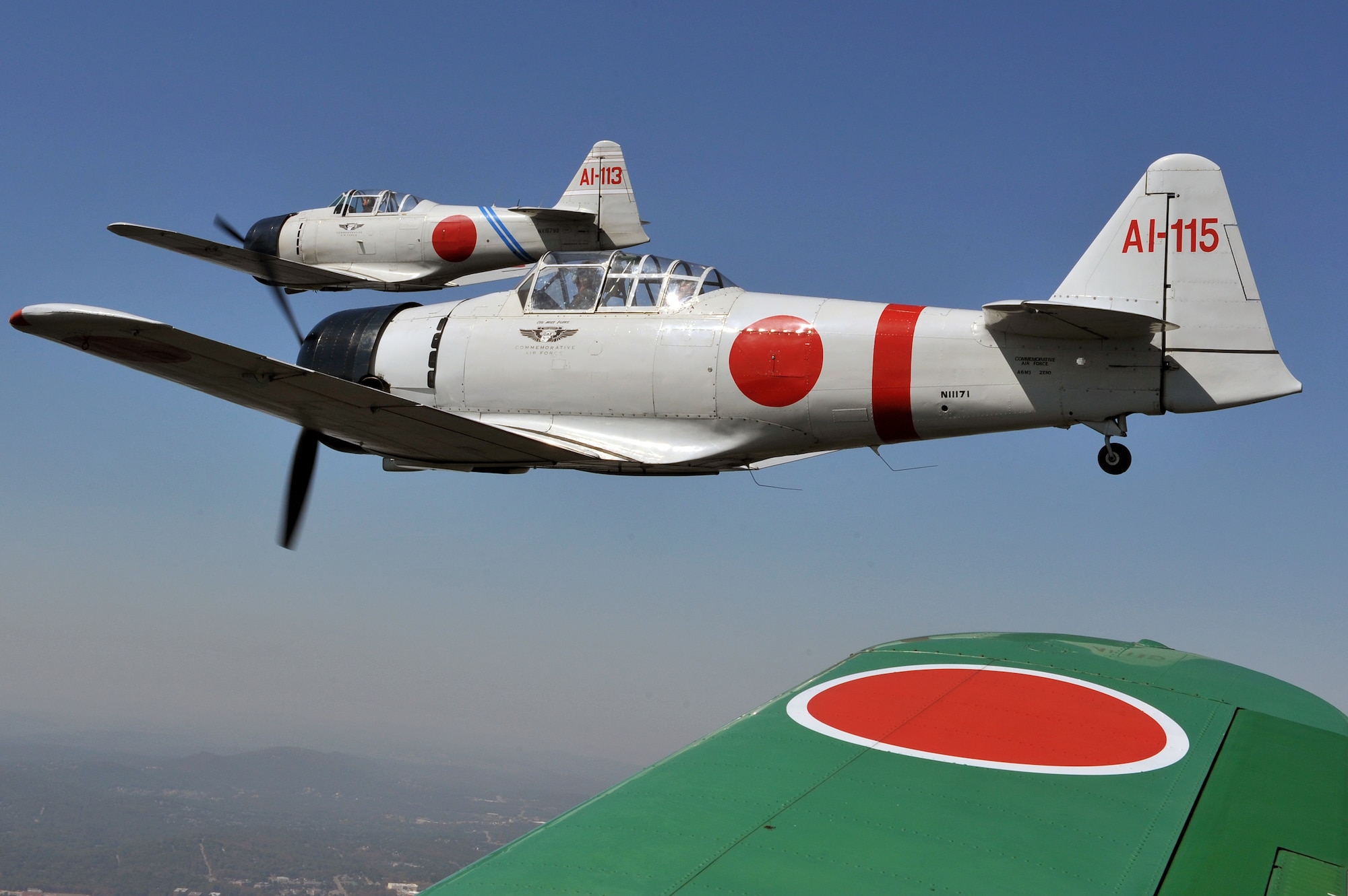 Two aircraft from the Tora, Tora, Tora demonstration team fly over Little Rock Oct. 8 during an incentive flight. Tora, Tora, Tora is a recreation of the Dec. 7, 1941, attack on Pearl Harbor. (U.S. Air Force photo by Staff Sgt. Chris Willis)