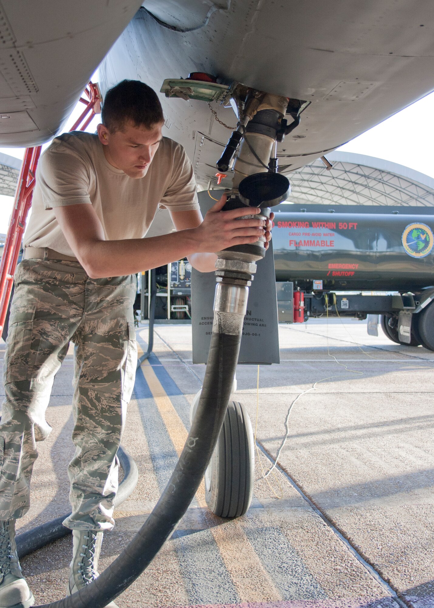 EGLIN AIR FORCE BASE, Fla. - Senior Airman Jacob Prine checks the fuel connection to a F-15 prior to a flight test of new environmentally-friendly fuel Oct.22. Aircrews from the 46th Test Wing and Air Force engineers evaluated flight parameters using a blend of standard JP-8 fuel and hydro-treated, renewable jet biofuel. This was the second test conducted at Eglin; an A-10 fuel test proved sucessful results in March.The Air Force is working toward an ambitious goal of changing half of the continental U.S. jet fuel requirement to alternative fuels by 2016. (U.S. Air Force photo/2nd Lt. Andrew Caulk)