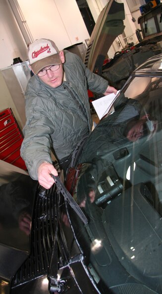 Tech. Sgt. Lloyd Fletcher-Boggs, 341st Logistics Readiness Squadron technical support specialist, checks a windshield wiper for wear during a free privately owned vehicle inspection Oct. 17 at building 870. The Airmen of the vehicle maintenance section will be on hand again Oct. 23 and 24 from 8 a.m. to 12 p.m. to inspect POVs. (U.S. Air Force photo/Staff Sgt. Dillon White)
