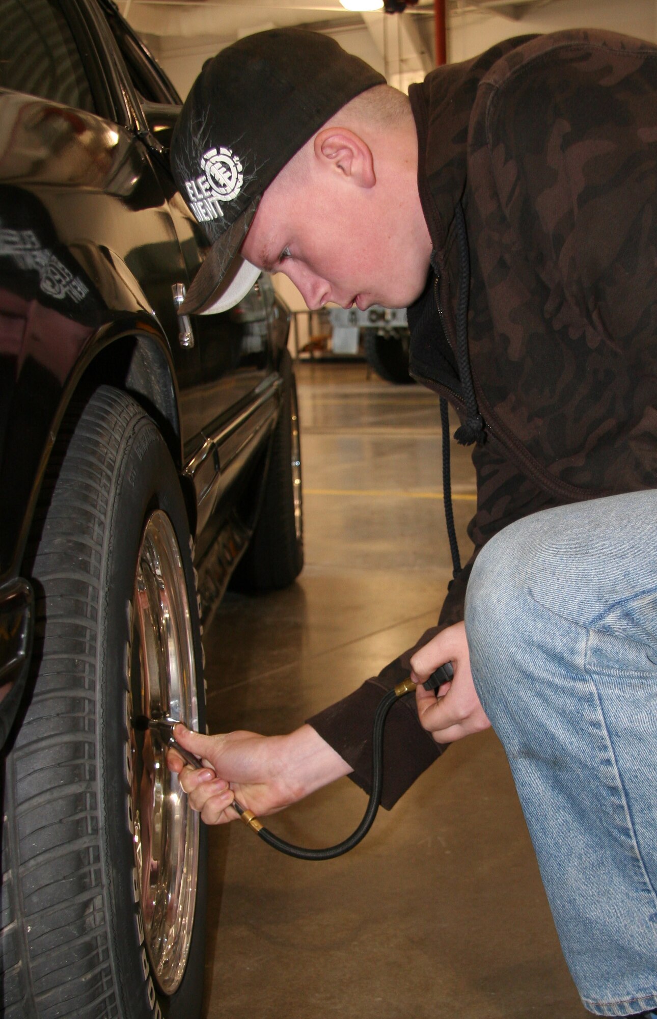 Airman 1st Class Brian Jordan, from the 341st Logistics Readiness Squadron heavy maintenance shop, checks air pressure in a tire during a free privately owned vehicle inspection Oct. 17 at building 870. Airman Jordan and other Airmen from vehicle maintenance will be on hand again Oct. 23 and 24 from 8 a.m. to 12 p.m. to inspect POVs. No appointment is necessary. (U.S. Air Force photo/Staff Sgt. Dillon White)