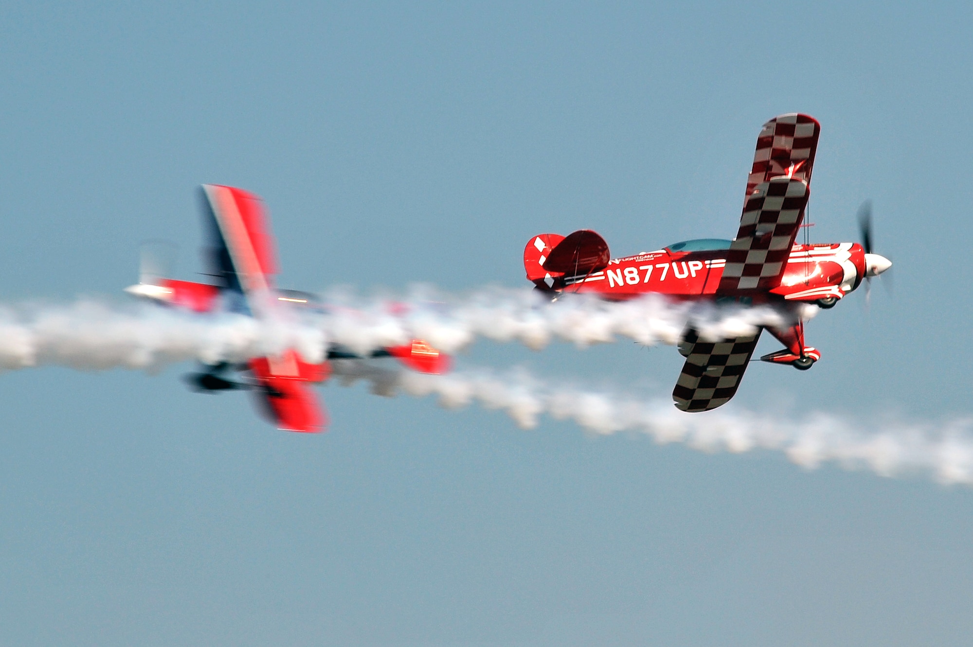 An Acroflights Pitts S-2B Biplane controlled by Patrick Carter performs for the air show crowd Oct. 9. The Pitts S-2B Biplane is a fully-certified 2nd place aerobatic aircraft weighing only 1,200 pounds. (U.S. Air Force photo by Staff Sgt. Chris Willis)