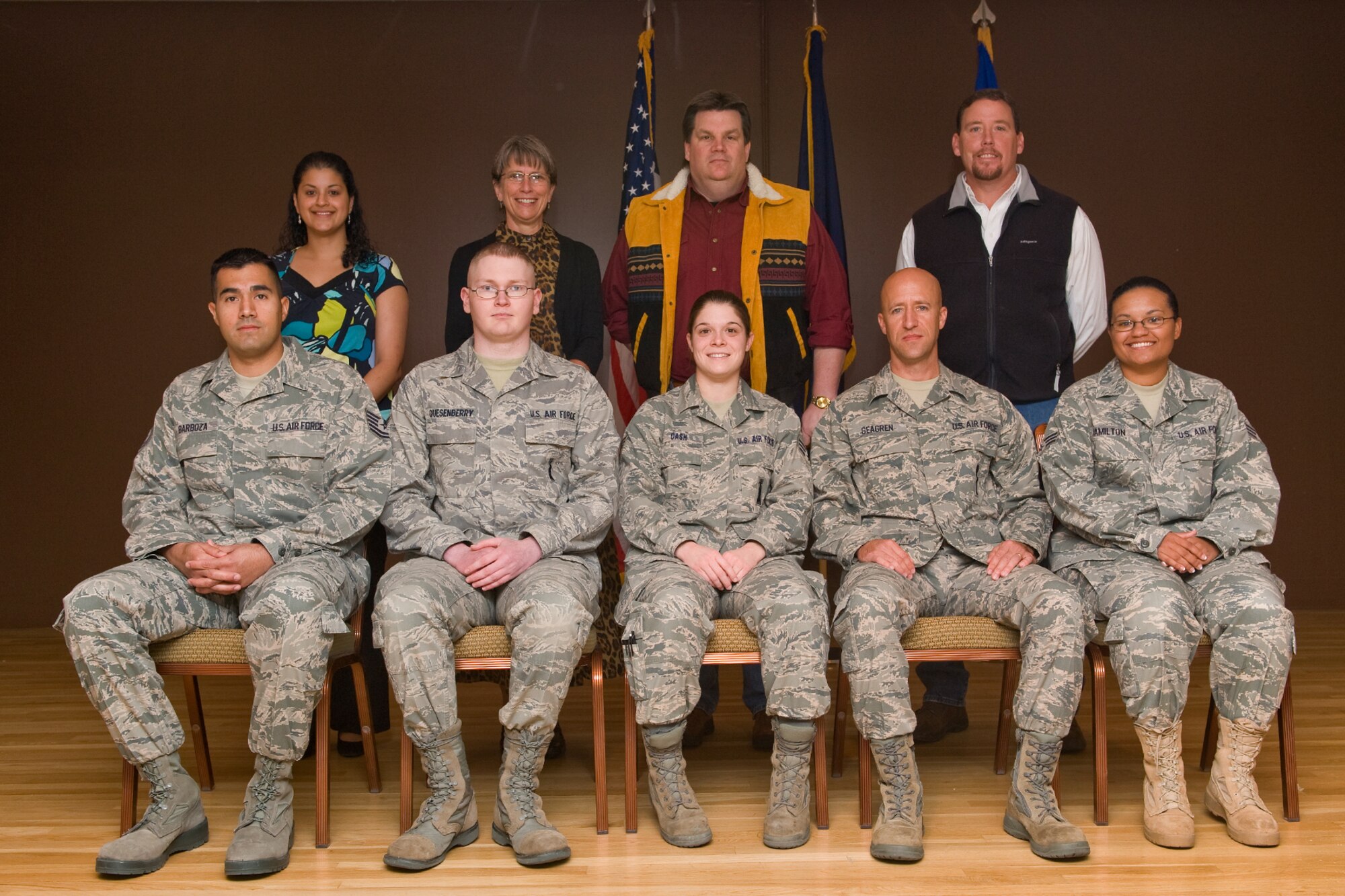 The following people were recognized for their outstanding achievements during the quarterly awards breakfast held at the Grizzly Bend Club Oct. 19. Back row:  Civilian Category I, Ms. Carolina Brost; Civilian Category II Supervisor, Ms. Carolyn Wood; Civilian Category II, Mr. Geoffrey Fallon; Civilian Category I Supervisor, Mr. Kelly Fletcher. Front row: Non-commissioned officer of the Quarter, Tech. Sgt. Nicanor Barboza; Dorm of the Quarter, Dorm 735 Representative Airman 1st Class Dustin Quesenberry; Honor Guard member of the Quarter, Senior Airman Nicoletta Cash;  Senior non-commissioned officer of the Quarter, Master Sgt. Frank Seagren; Airman of the Quarter, Senior Airman Tambara Hamilton. Names the team of the Quarter was the 341st Medical Group laboratory, whose members are Mr. Fallon, Sergeant Barboza and Airman Hamilton. The Company Grade Officer of the Quarter, Capt. Gregory Tengco, was not present for the picture. (U.S. Air Force Photo / Beau Wade)