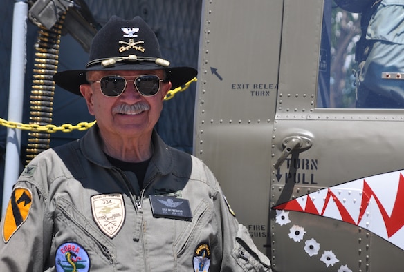 Army Col. (ret.) Bill McPherson is the honorary commander for the 34th Aeromedical Evacuation Squadron. Colonel McPherson proudly displayed and gave tours of his restored UH-1 (M) 'Huey' to 302nd Airlift Wing families during the wing's Family Day at Peterson Air Force Base on Saturday of the August Unit Training Assembly. (U.S. Air Force photo/Ann Skarban)