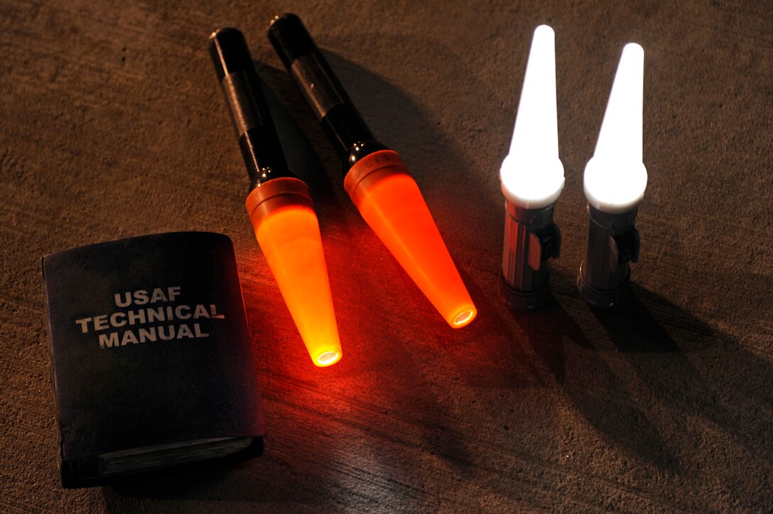 ELLSWORTH AIR FORCE BASE, S.D. – A technical manual and two sets of marshalling wands, belonging to the 28th Aircraft Maintenance Squadron, sit on the flightline during a Phase II Operational Readiness Inspection, Oct. 14.  The 28th AMXS ensures compliance with technical data, safety, security, documentation and supply procedures. (U.S. Air Force photo/Staff Sgt. Marc I. Lane)