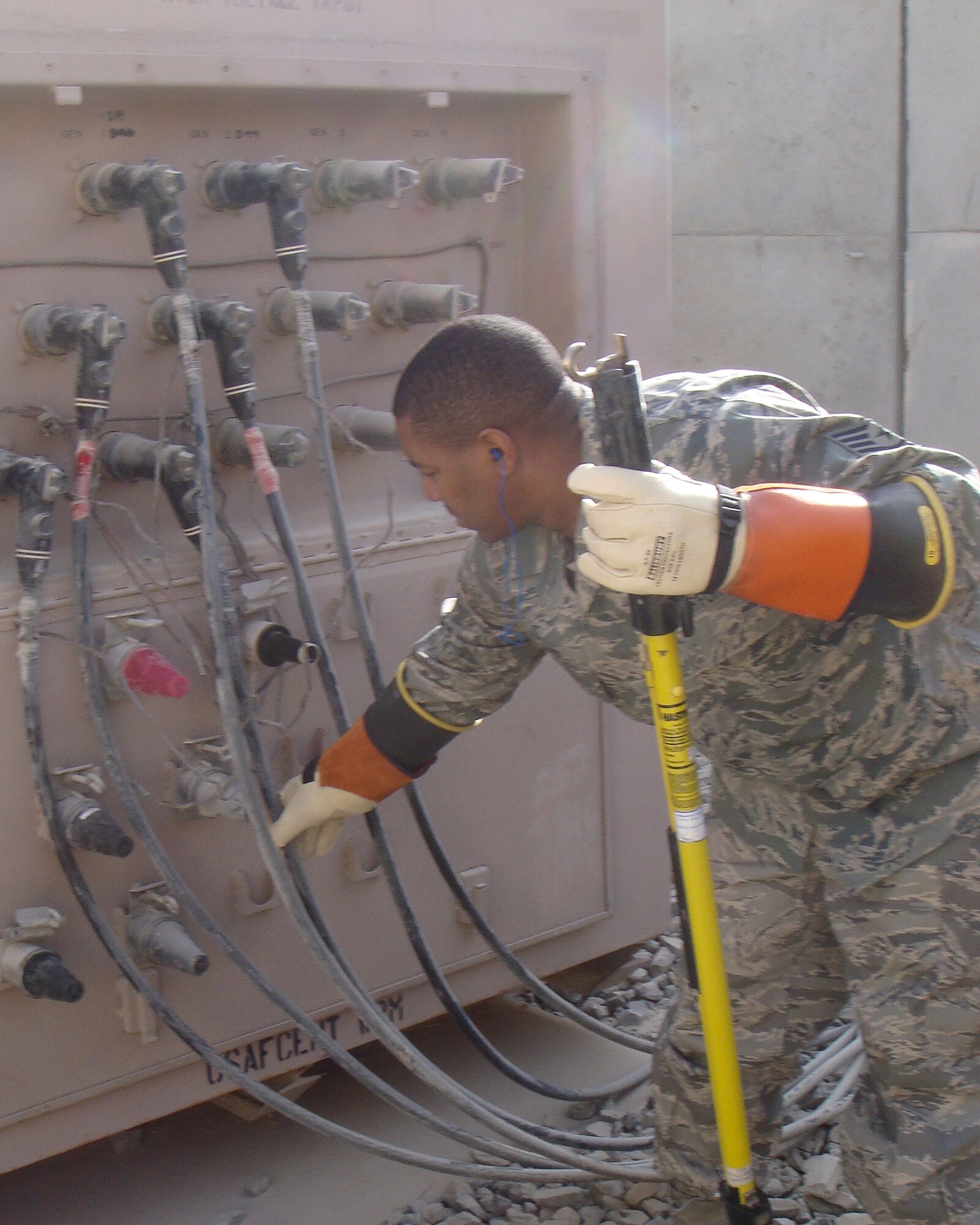 Tech. Sgt. John Jones removes power cables from a generator Oct. 20, 2010, at Kandahar Airfield, Afghanistan. The 451st ECES supports more than 2,000 customers and respond to an average of 35 work orders daily to support the 451st Air Expeditionary Wing. Sergeant Jones is a 451st ECES electrician and is deployed from Kadena Air Base, Japan. (Courtesy Photo)