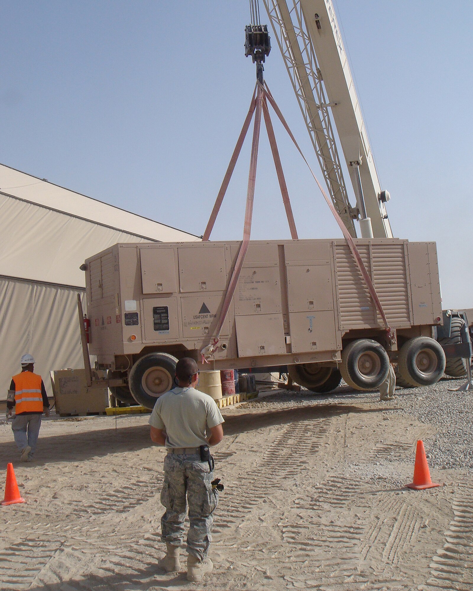 Airmen from the 451st Expeditionary Civil Engineer Squadron reposition power generators recently at Kandahar Airfield, Afghanistan. The 451st ECES supports more than 2,000 customers and respond to an average of 35 work orders daily to support the 451st Air Expeditionary Wing. (Courtesy Photo)
