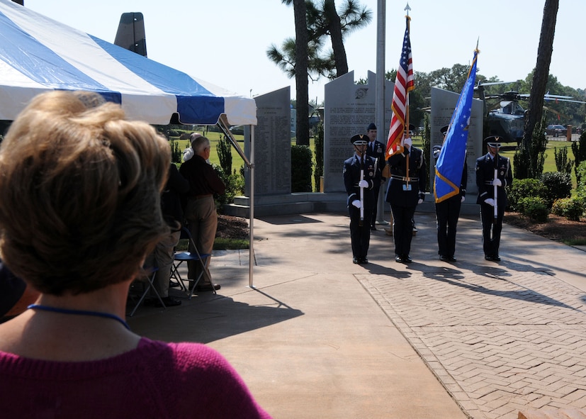 Attendees observe the honor guard’s presentation of the colors during an Air Commando Association memorial ceremony Oct. 10 at Hurlburt Field, Fla.  The 30th anniversary memorial paid tribute to fallen special operators involved in Operations Desert One and Eagle Claw, the ill-fated attempt to rescue American hostages in Iran.  Despite their tragic outcome the operations were credited as the catalyst that led to the formation of United States Special Operations Command and subsequently Air Force Special Operations Command. The ceremony culminated in an MC-130E fly-over by the 711th Special Operations Squadron from Duke Field.  (U.S. Air Force Photo/Staff Sgt. Jonathan McCallum)